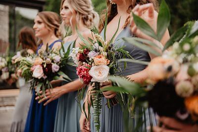 image of Bridesmaids with flower bouquetes in their hands